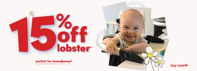 smiling toddler sitting in highchair attached to kitchen table - get 15% off lobster™ portable highchair